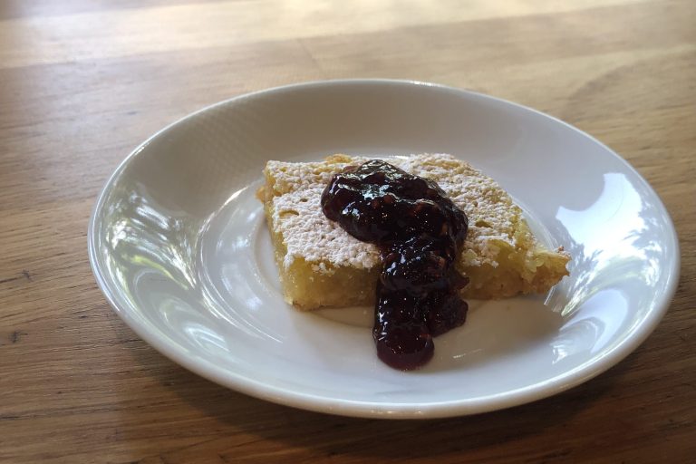 Lemon bar topped with raspberry jam